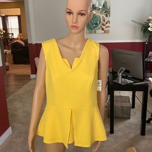 Beautiful yellow sleeveless top. Dress it up or down